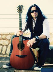 Gus G with his LAG acoustic guitar