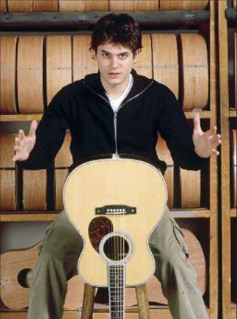 John Mayer pictured with a Martin 00-45SC John Mayer Edition Acoustic Guitar